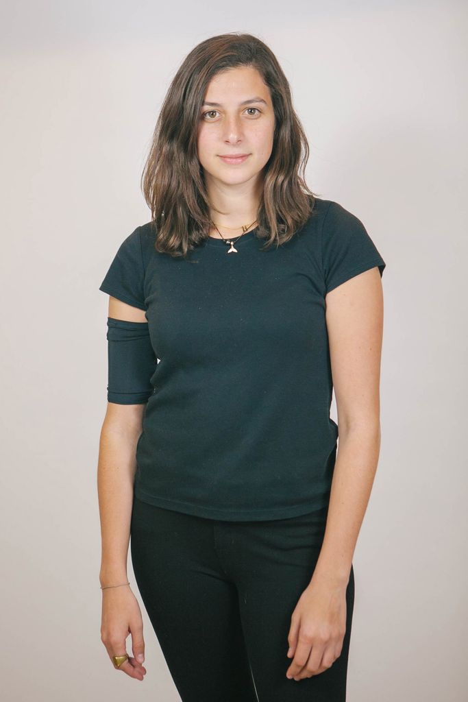 Hannah Olsen wears a sleeve covering her permanent pic line