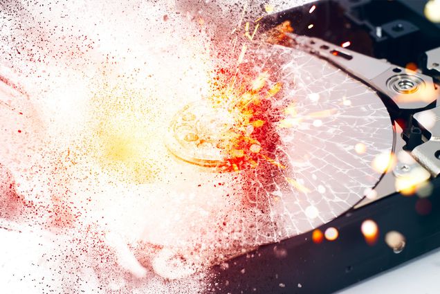 Illustration of a computer hard disk exploding.