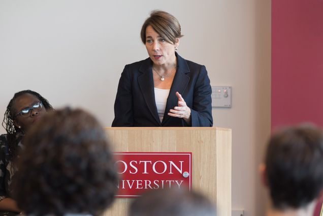 Maura Healey speaks to reporters at the podium