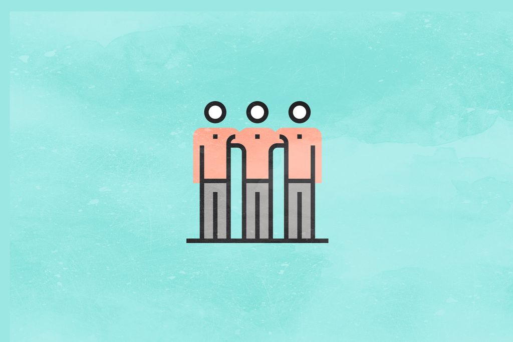 three figures have their arms around each other