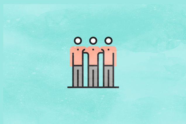 three figures have their arms around each other