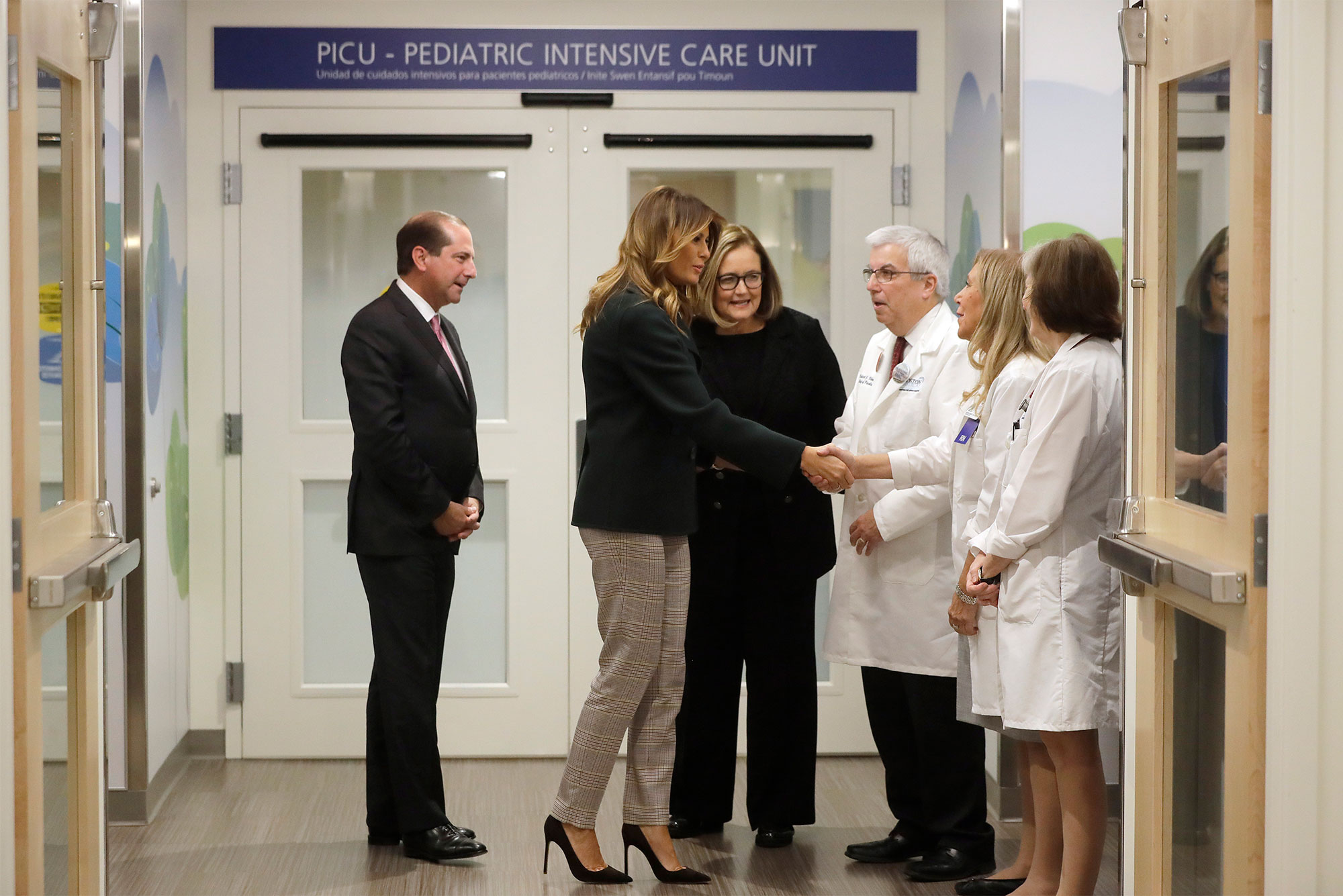 First Lady Melania Trump meets pediatric doctors and nurses as she tours the Boston Medical Center Pediatric Intensive Care Unit with BMC President and CEO Kate Walsh and US Secretary of Health and Human Services Alex Azar.