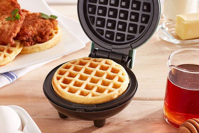 A waffle-maker sits on a table