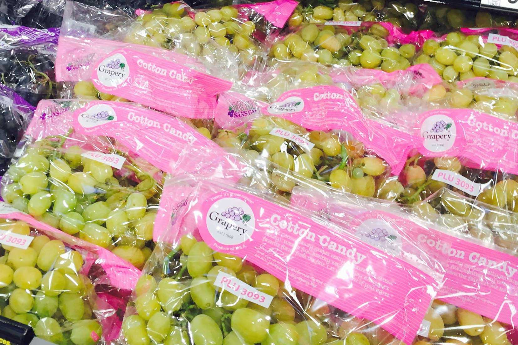 Bags of Cotton Candy Grapes on display in a groccery store