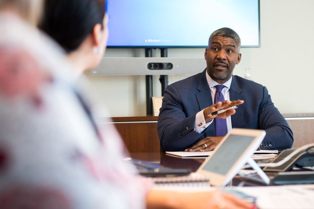 A photo of Paul Francisco in a business meeting