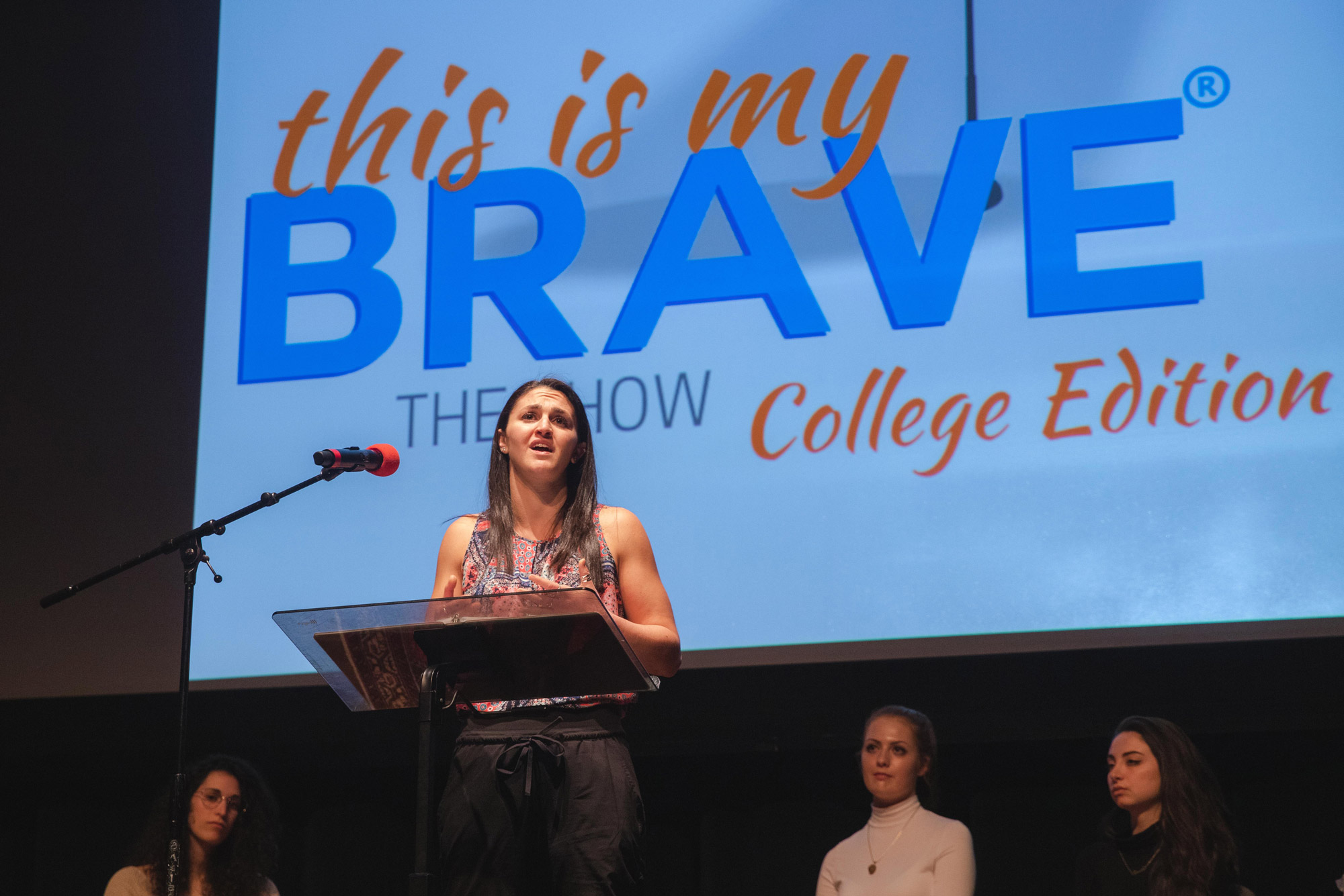 A photo of Ali Gold (SAR'20) sharing her experience of studying and struggling with mental health issues during the "This is My Brave," storytelling performance at the Tsai Performance Center