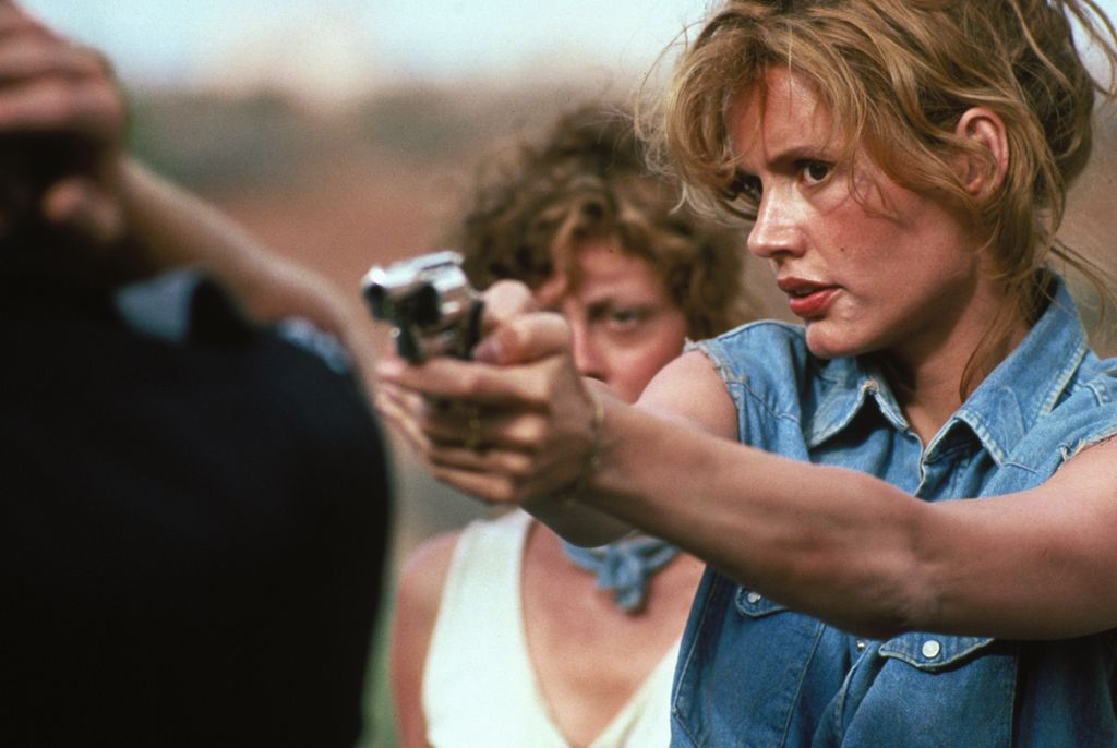 Geena Davis holds a man at gunpoint in the movie Thelma & Louise.