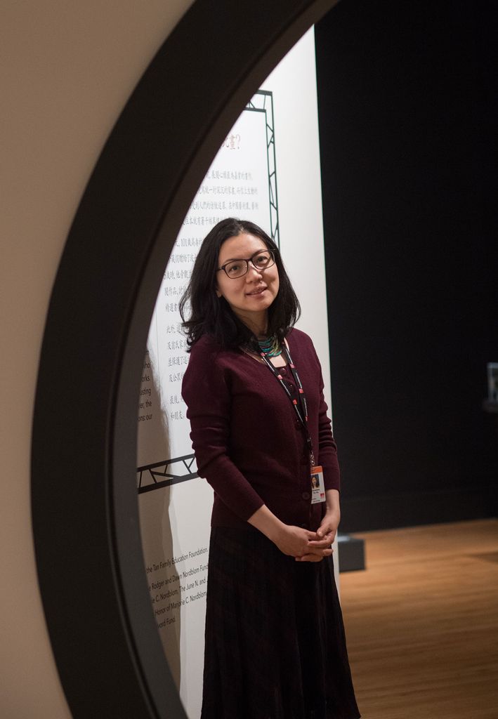 Portrait of Matsutaro Shoriki, Chair of Asian Art at the Museum of Fine Arts, Boston shot through a curved doorway.