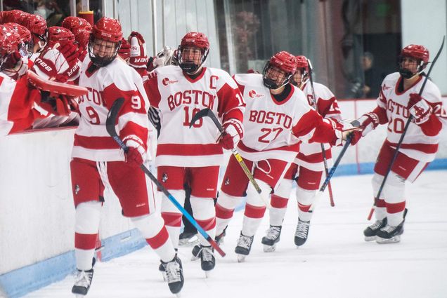 Members of BU's women's hockey team celebrate after scoring a goal in the first quarter against Boston College during the Women’s Beanpot tournament on Tuesday, February, 4, 2020