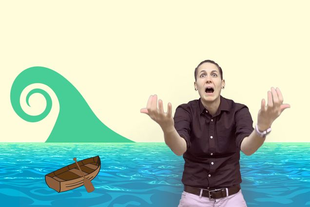 Screenshot of Aiken Bottoms from her “Building a Boat” lesson that’s included on the Deaf Education Library, a new resource for deaf children. A cartoon boat and wave are seen behind Aiken, who looks shocked as the wave approaches in the story.