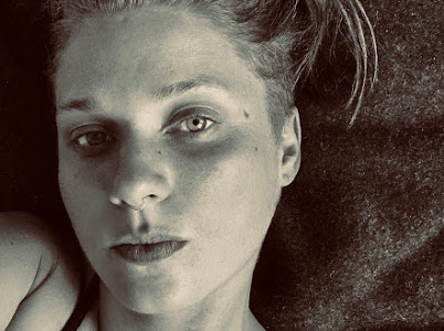 Black and white photo of Diana Walsh, laying down.