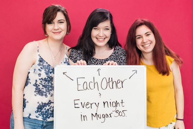 Students holding a sign that they will miss each other