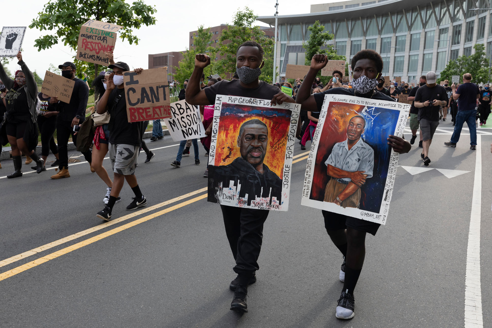 On Saturday, June 6, people carried signs protesting police brutality at the University of Massachusetts in Boston after the death of George Floyd.