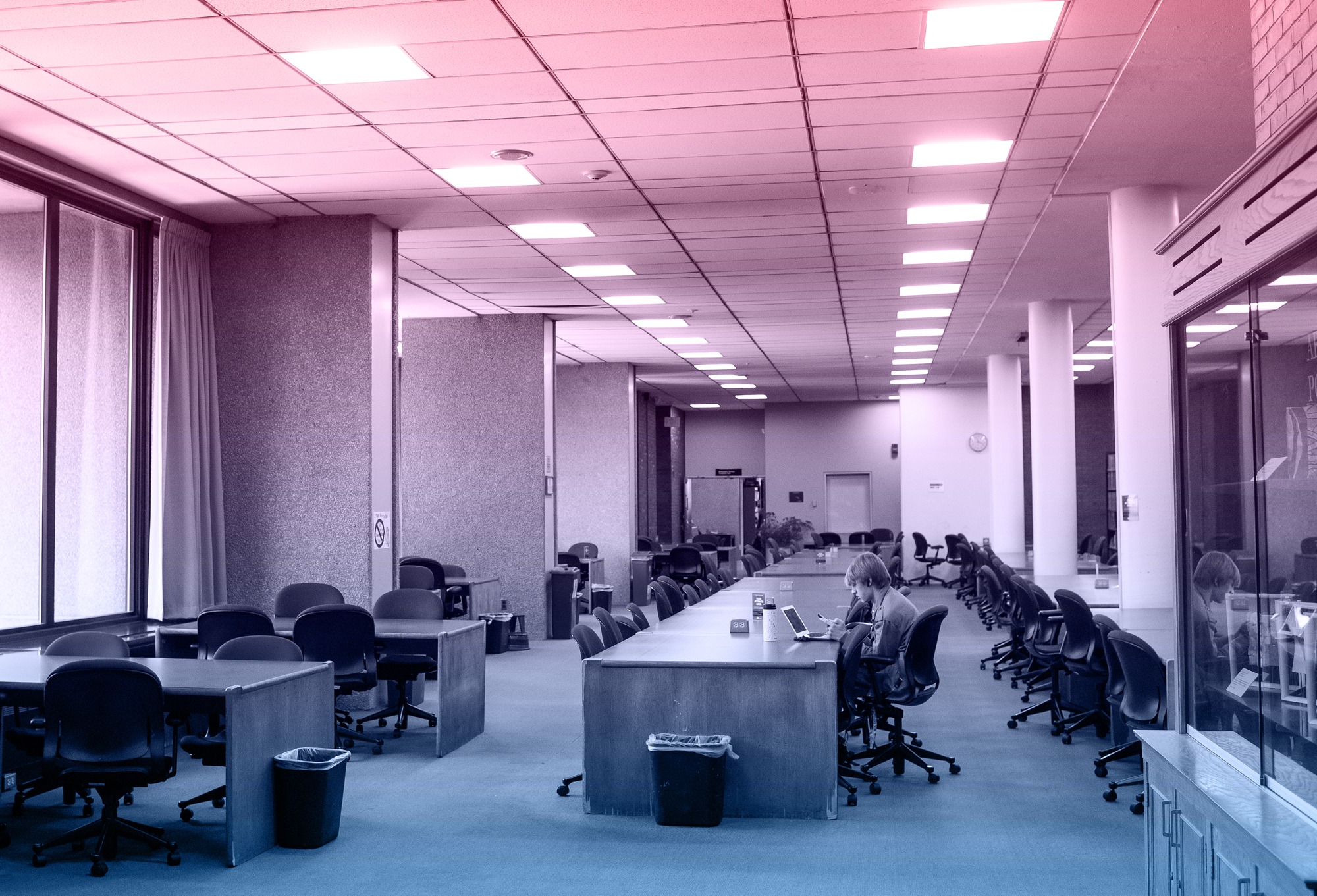 Photo of students studying at the Mugar Library during campus quarantine.