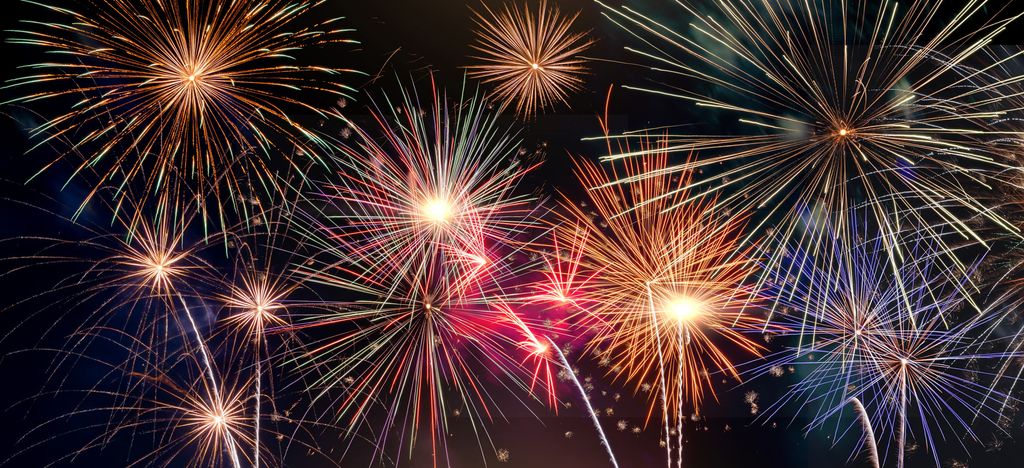 A photo of fireworks against a nigh sky