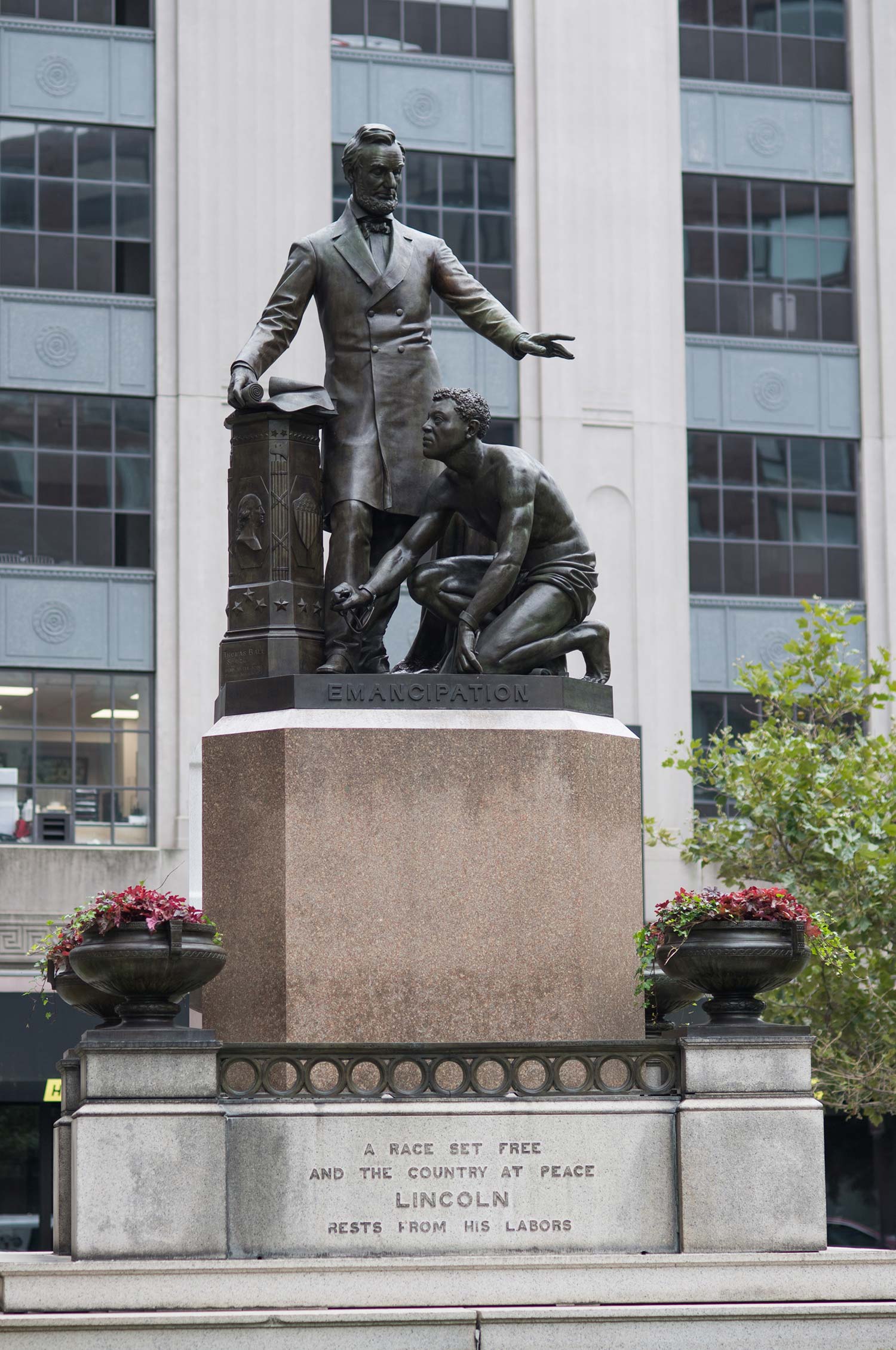 The Emancipation Group statue in Boston's Park Square. The statue shows Abraham Lincoln towering over a crouched and half-naked formerly enslaved man, Archer Alexander.