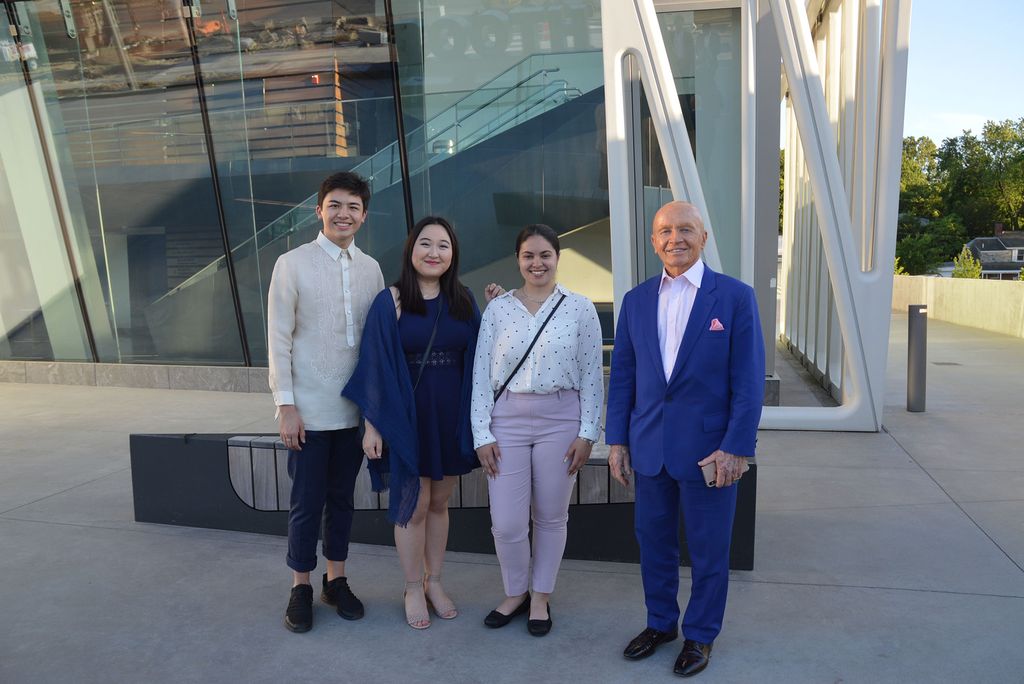 Every so often, Mobius’ travels bring him back through Boston, and he loves meeting students treading the CFA boards, just like he did more than 60 years ago. In the photo, Mobius is seen standing next to 3 CFA students outside of a building.
