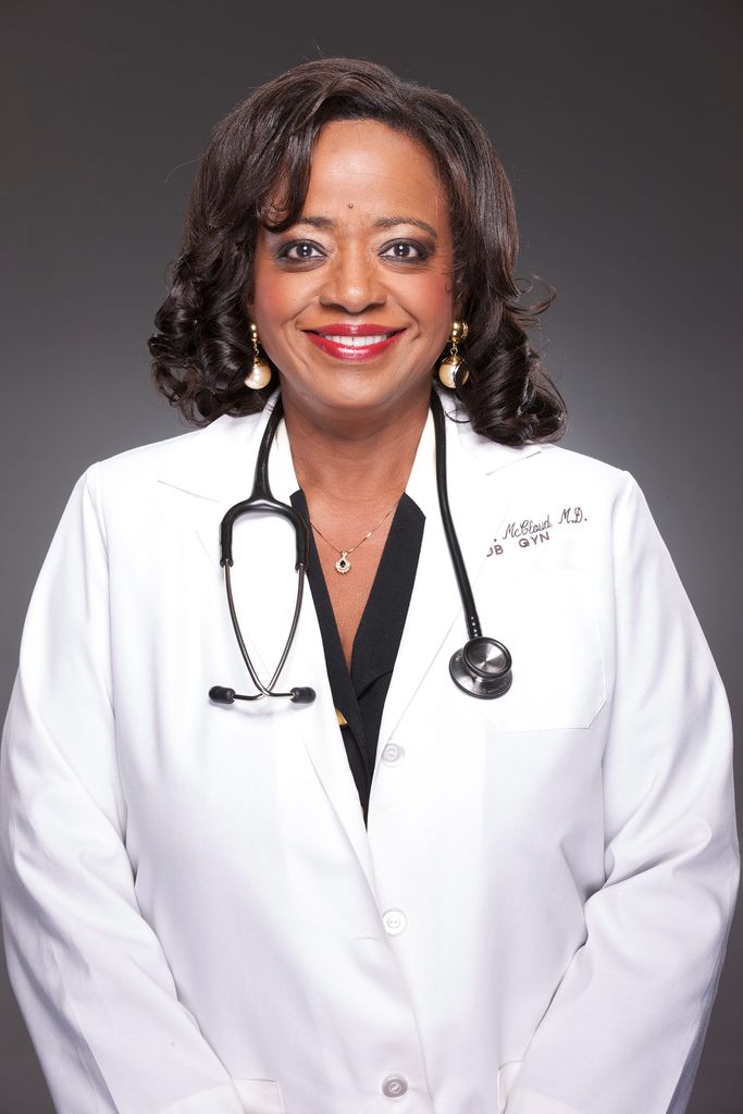 Portrait of Melody McCloud (CAS’77, MED’81), an OB/GYN at Emory University Hospital and founder and medical director of Atlanta Women’s Health Care, in a white coat and with a stethoscope around her neck.