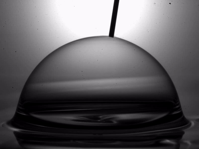 A gif animation of a bubble being popped and collapsing