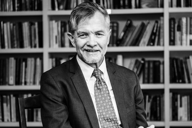 A black and white portrait photograph of Dean David Chard