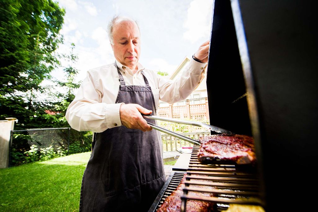 Greg Blonder grilling in his backyard