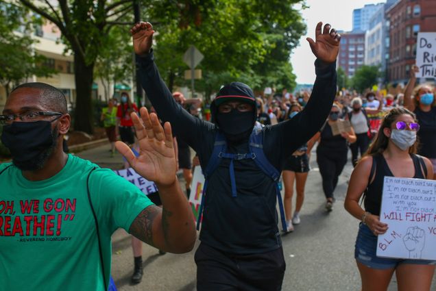 A photo of protestors walking in a march against police brutality in Boston in July 2020