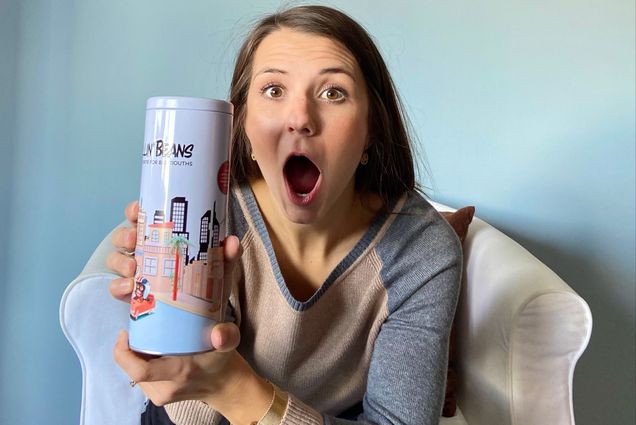 A photo of Haley Horn (Questrom’19) holding up the Spillin' Beans game
