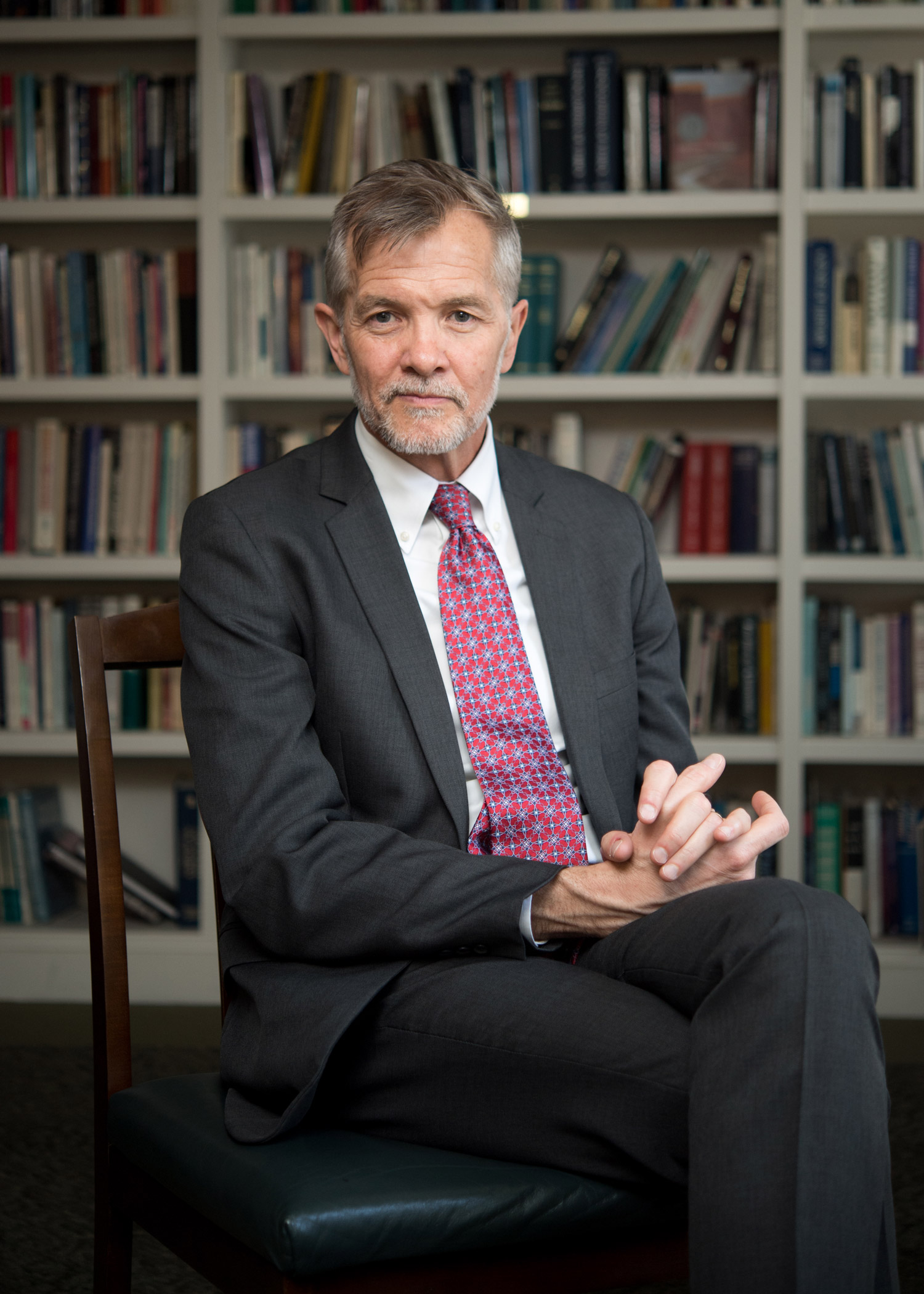 A portrait photo of David Chard sitting in his office
