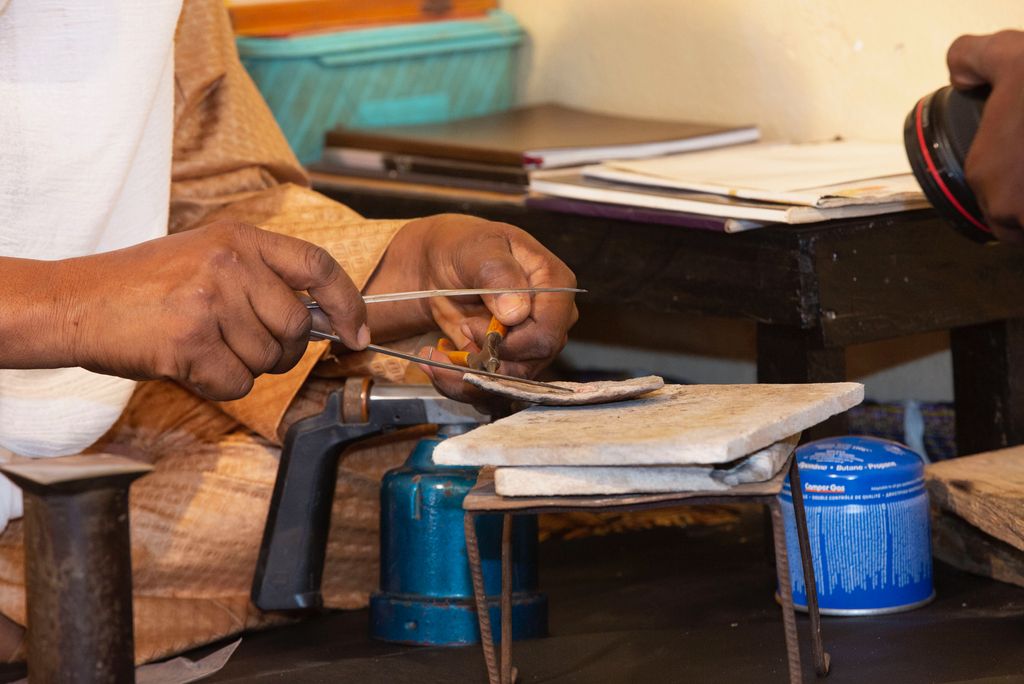A photo showing part of the process of making a ring of sterling silver