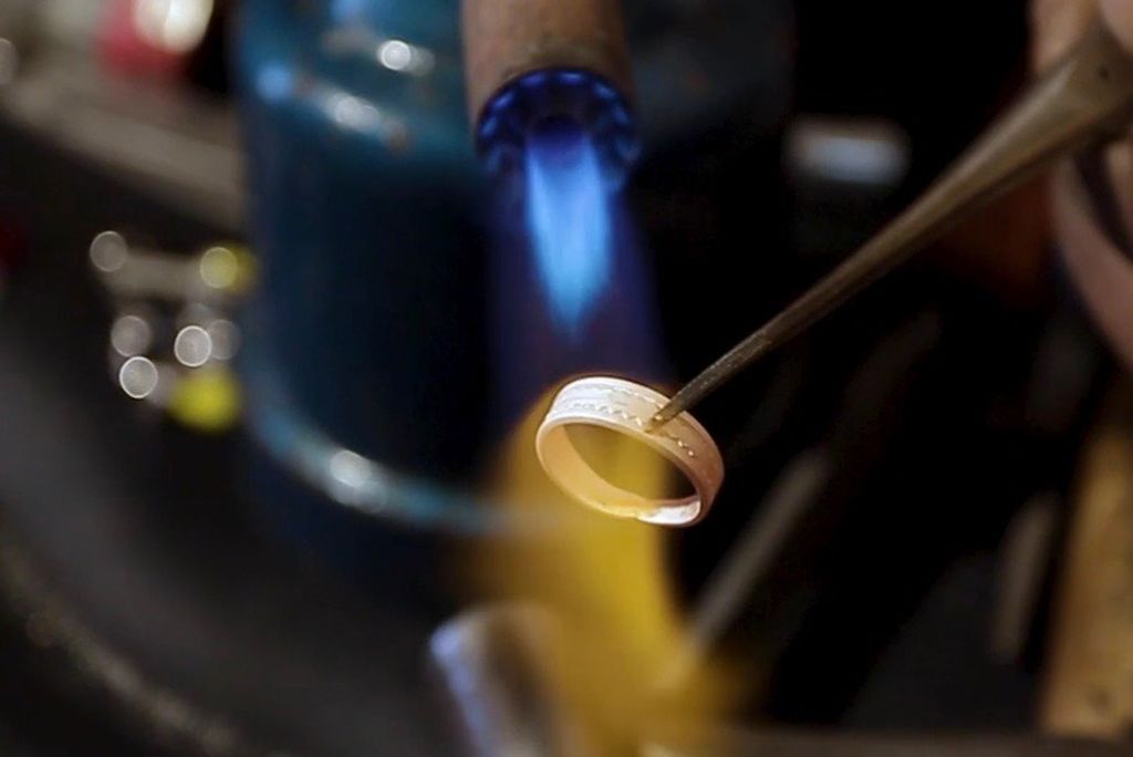 Artisan M. Adam molding a piece of Tchidite jewelry
