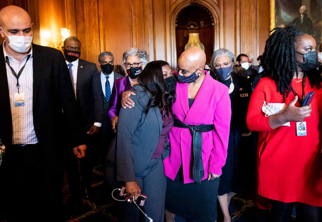 Democratic representative Cori Bush hugs representative Ayanna Pressley after listening to the Derek Chauvin verdict.