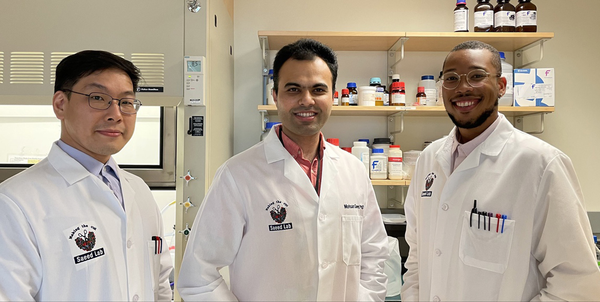 A photo of Mohsan Saeed (center) and members of his NEIDL lab, Da-Yuan Chen (left) and Hasahn Conway (right)