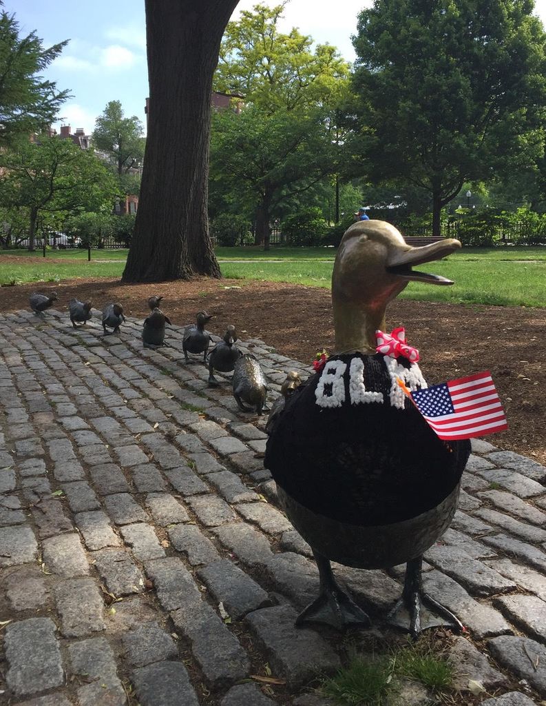 Nancy Schon's Make Way for the Ducklings sculpture in Boston decorated with the mother duck in a Black Lives Matter sweater.