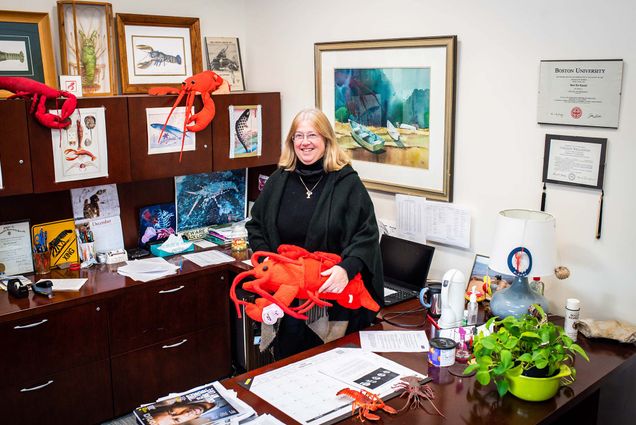Kari Lavalli stands in her CGS office at Boston University