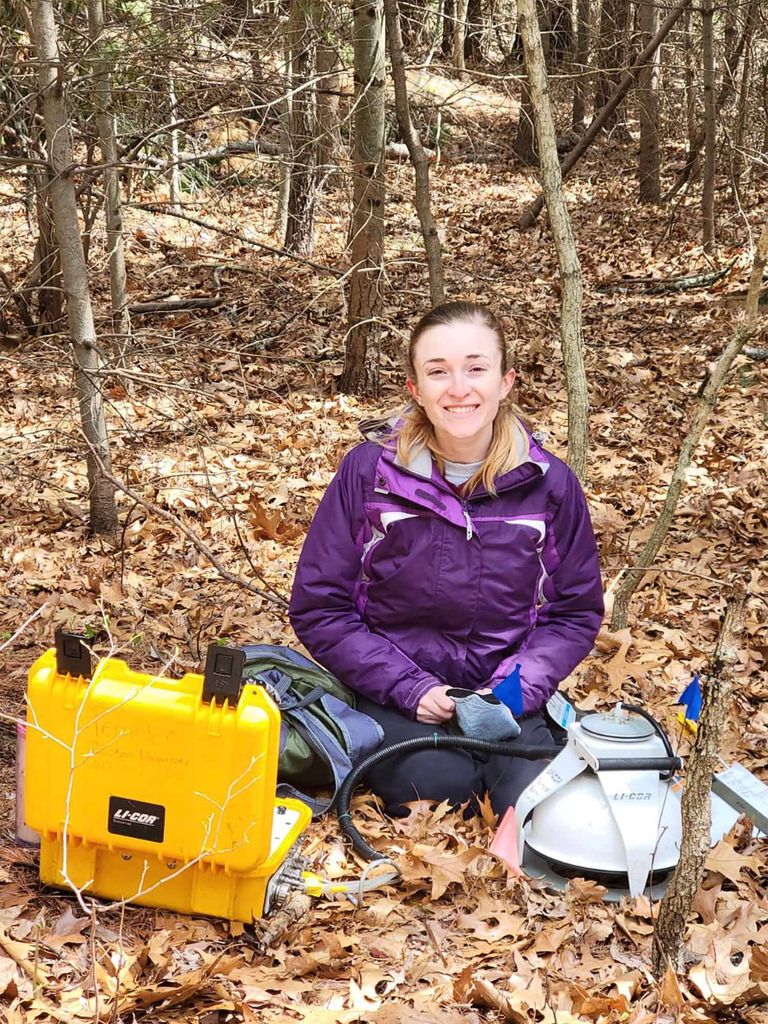 Sarah Garvey taking measurements at the Arnold Arboretum. Photo credit: Hristiana Stoynova