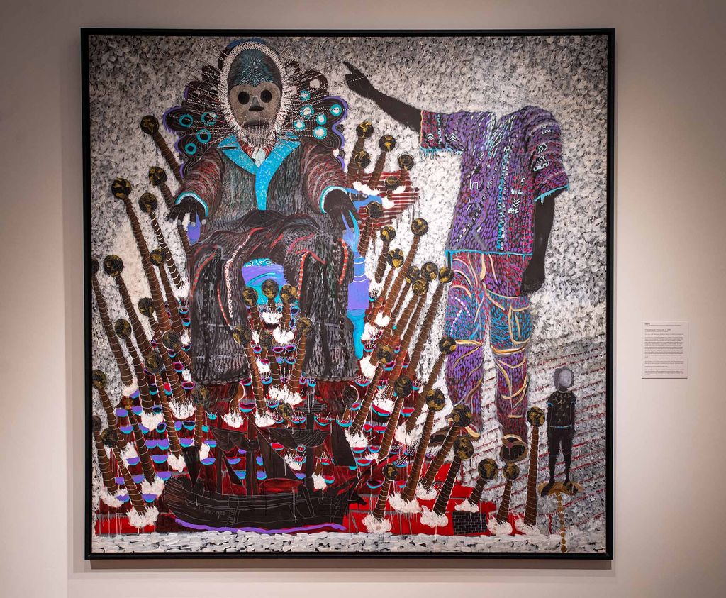 Photo of Promenade masquée 2 (2016) by Senegalese artist Omar Ba. In the painting, a masked figured with what looks like needles sticking out of their face sits on a throne above of a large sail boat. To the right, a headless figure reaches towards the head of the figure on the throne. A small stands looking off to their left.