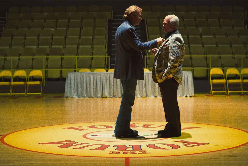 Two men in suits have a heated discussion on the court at TD Garden in Boston