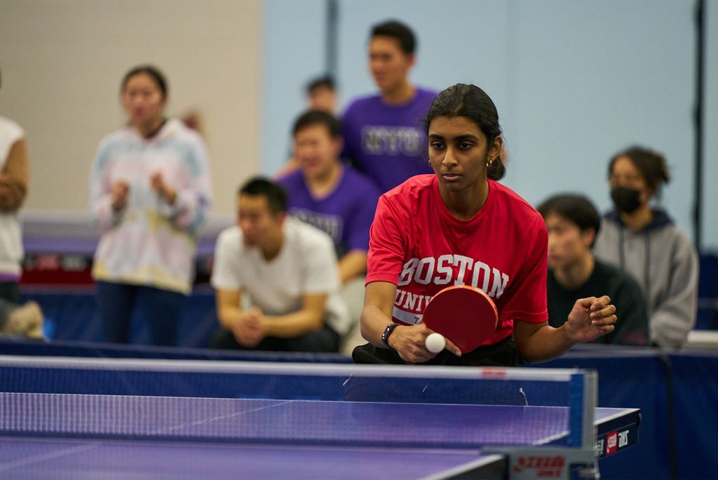 Meha Prabhu (CAS/MED’26) is one of six Terrier women who will be competing as a team at the collegiate table tennis national tournament later this week. Here she hits a table tennis ball with her paddle during a competition