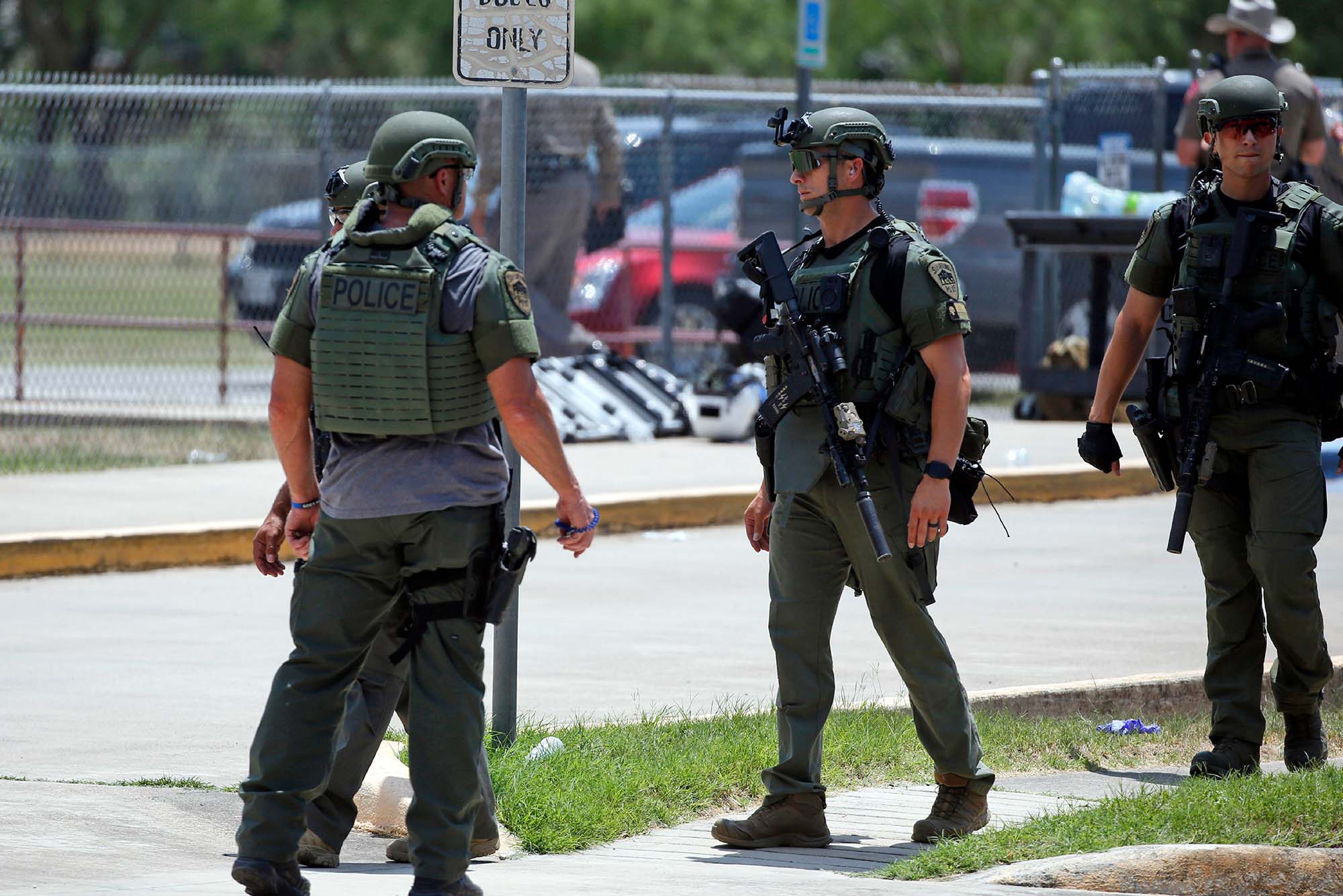 Law enforcement personnel stand outside Robb Elementary School following a shooting, Tuesday, May 24, 2022, in Uvalde, Texas. (AP Photo/Dario Lopez-Mills)