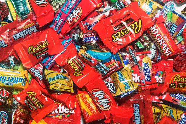 Photo: A pile of different types and brands of candy are shown.