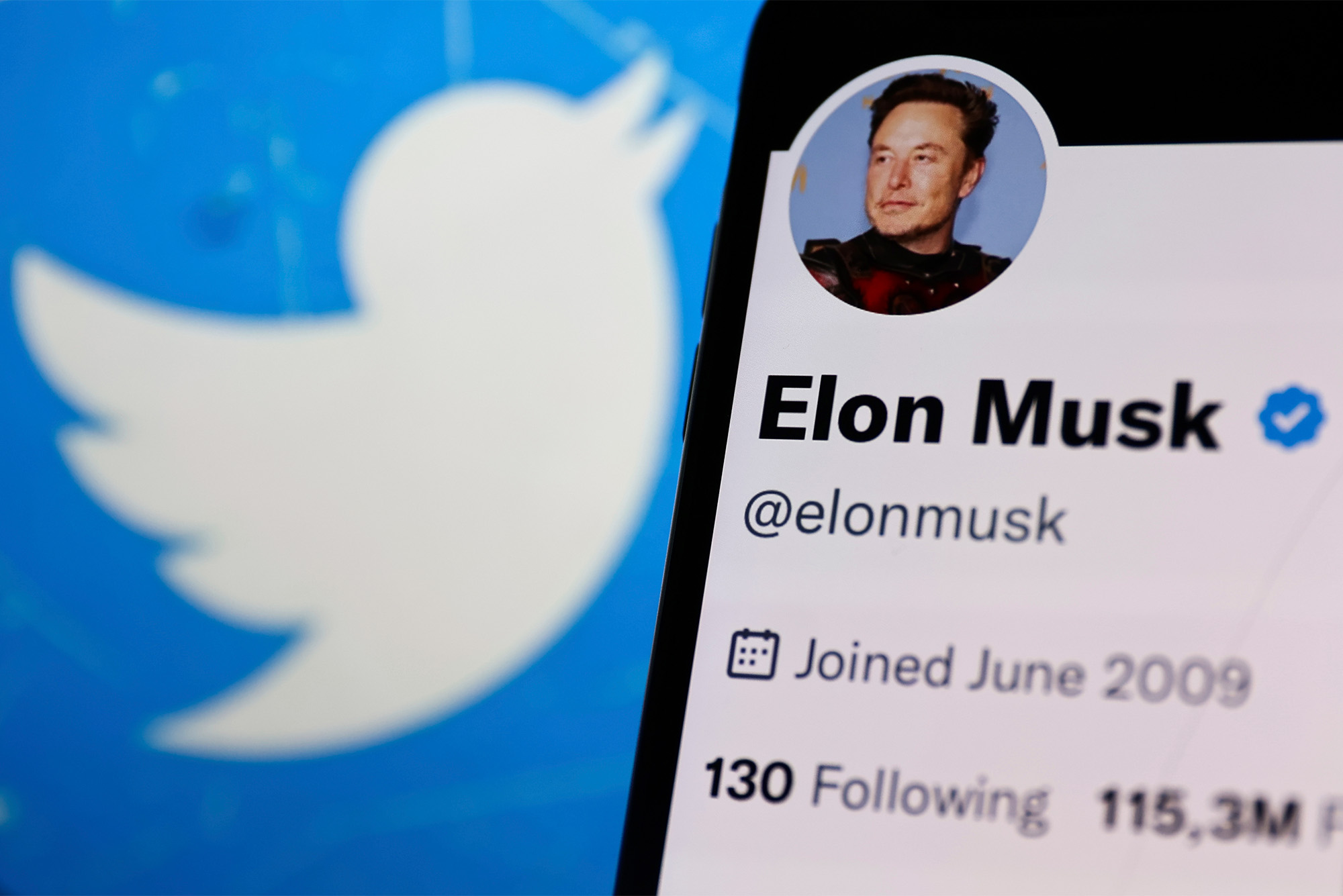 A composite image showing the Twitter icon (a white bird) next to a twitter profile named "Elon Musk" with only 130 followers. The profile has a blue check mark.