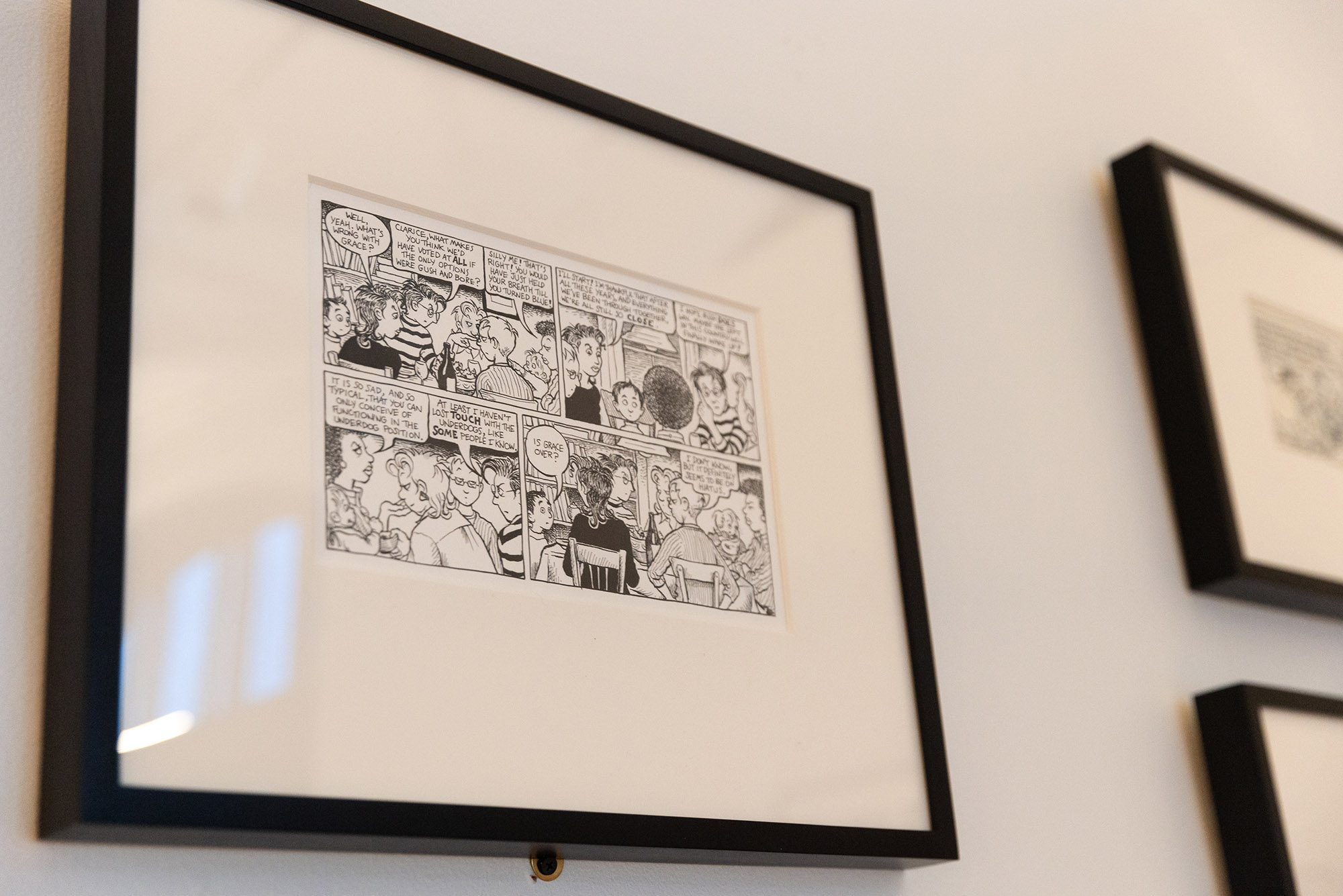 Photo: A framed image of an original sheet from Alison Bechdel’s Dykes to Watch Out For, on loan from the Library of Congress.