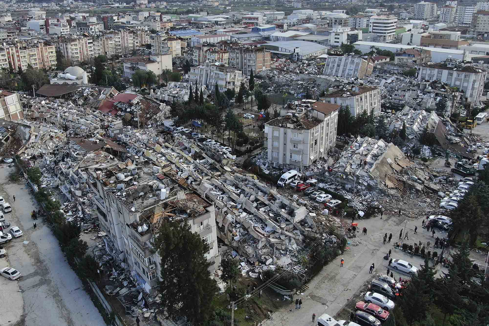 Photo: Aerial photo shows the destruction in Hatay city center, southern Turkey, Tuesday, Feb. 7, 2023. A city center is shown with numerous collapsed and crumbling building.