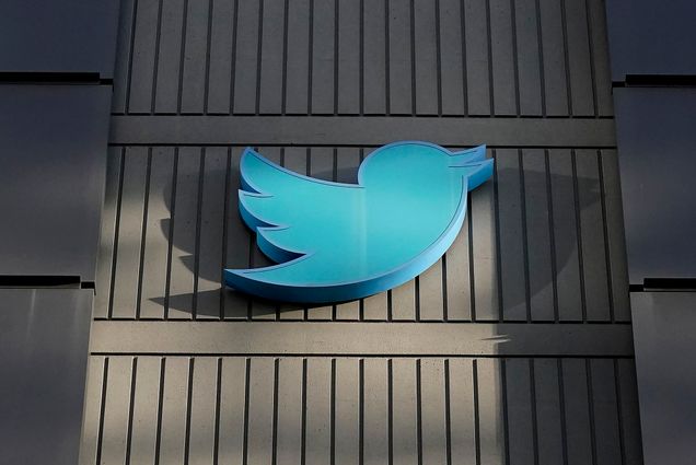 Photo: Front exterior of the Twitter headquarters is shown in San Francisco is shown. the large, light blue twitter logo is shown on a dark brown building.