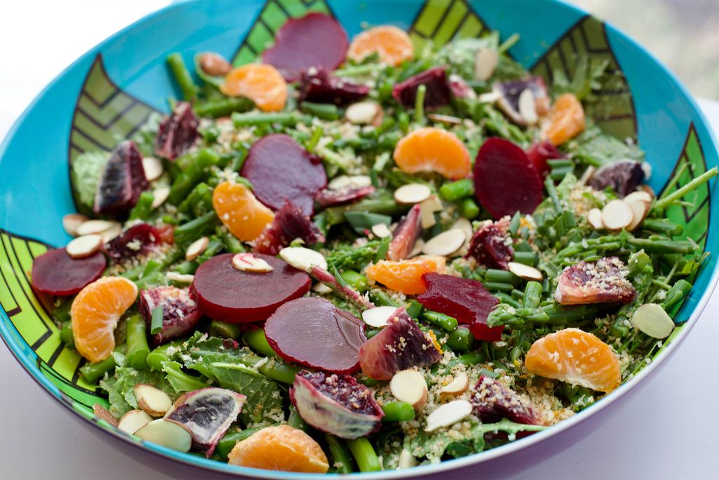 Photo: Upclose picture of a spring salad with beats, nuts, lettuce, and more