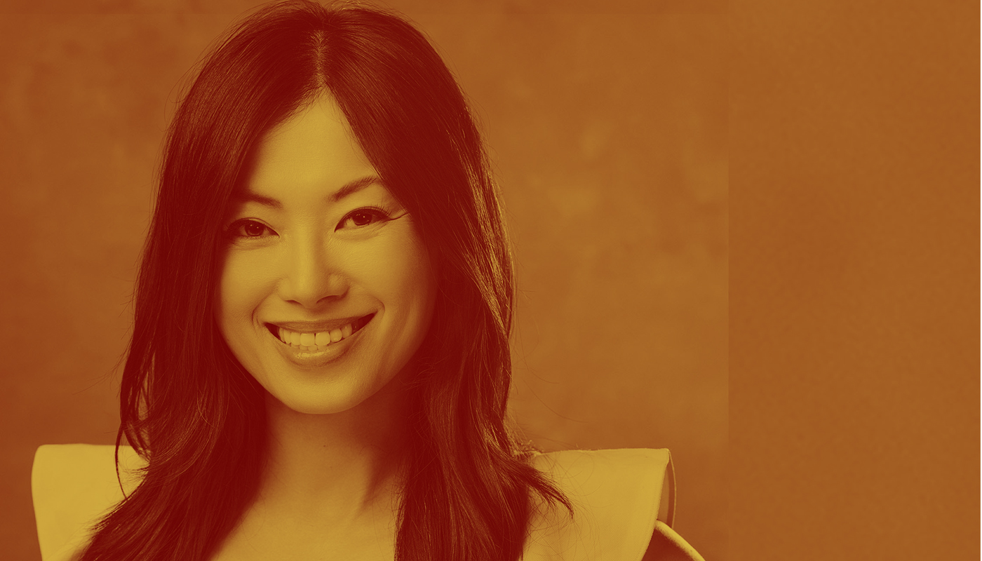 Photo: Jennifer Yen, an Asian woman with long black hair, smiles for a portrait. The picture has a yellow overlay.