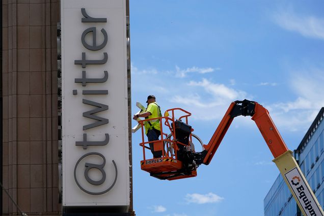 Photo: A workman removes a character from a sign on the Twitter headquarters building in San Francisco, Monday, July 24, 2023. Elon Musk has unveiled a new "X" logo to replace Twitter's famous blue bird as he follows through with a major rebranding of the social media platform he bought for $44 billion last year. The X started appearing at the top of the desktop version of Twitter on Monday, but the bird was still dominant across the smartphone app. (AP Photo/Godofredo A. Vásquez)