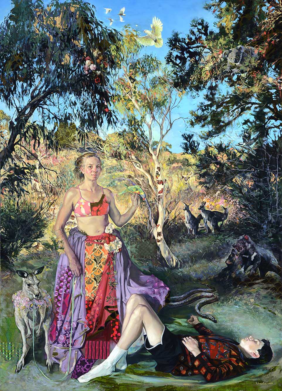 Image: Photo of an oil on canvas painting with paper collage also used as a medium. Image shows a white woman wearing a long skirt and bandeau cobbled together with fabrics of various patterns. She holds a leash attached to a small kangaroo with a lei around its neck as a young child with black hair and wearing a red plaid shirt, black shirt, and white socks lies at her feet. They all stand in a bushy, green area as various other marsupials look to them from the distance.