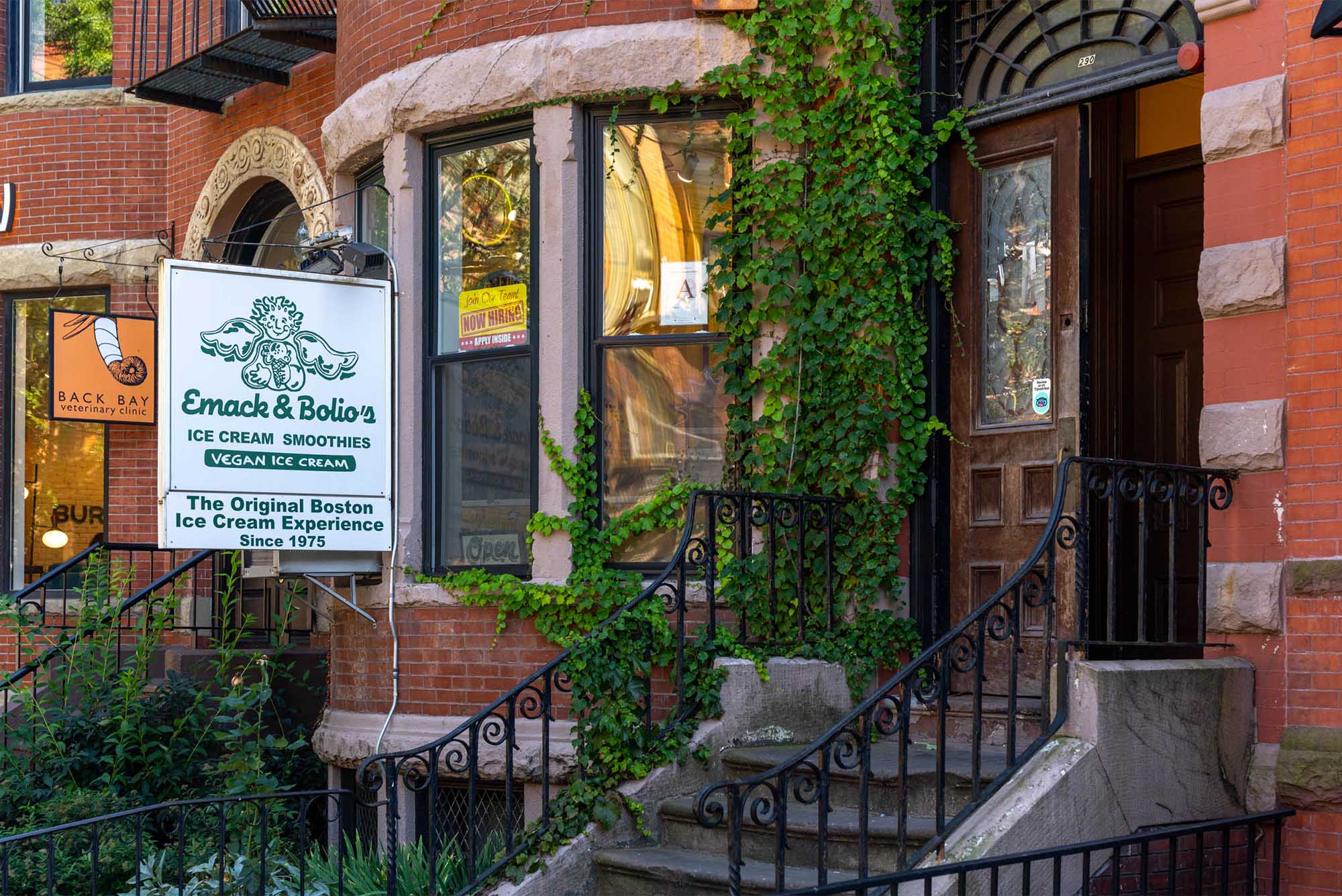 Photo: Emack & Bolio's ice cream shop in Boston, MA, an older brick building with tall windows and iron staircase railings