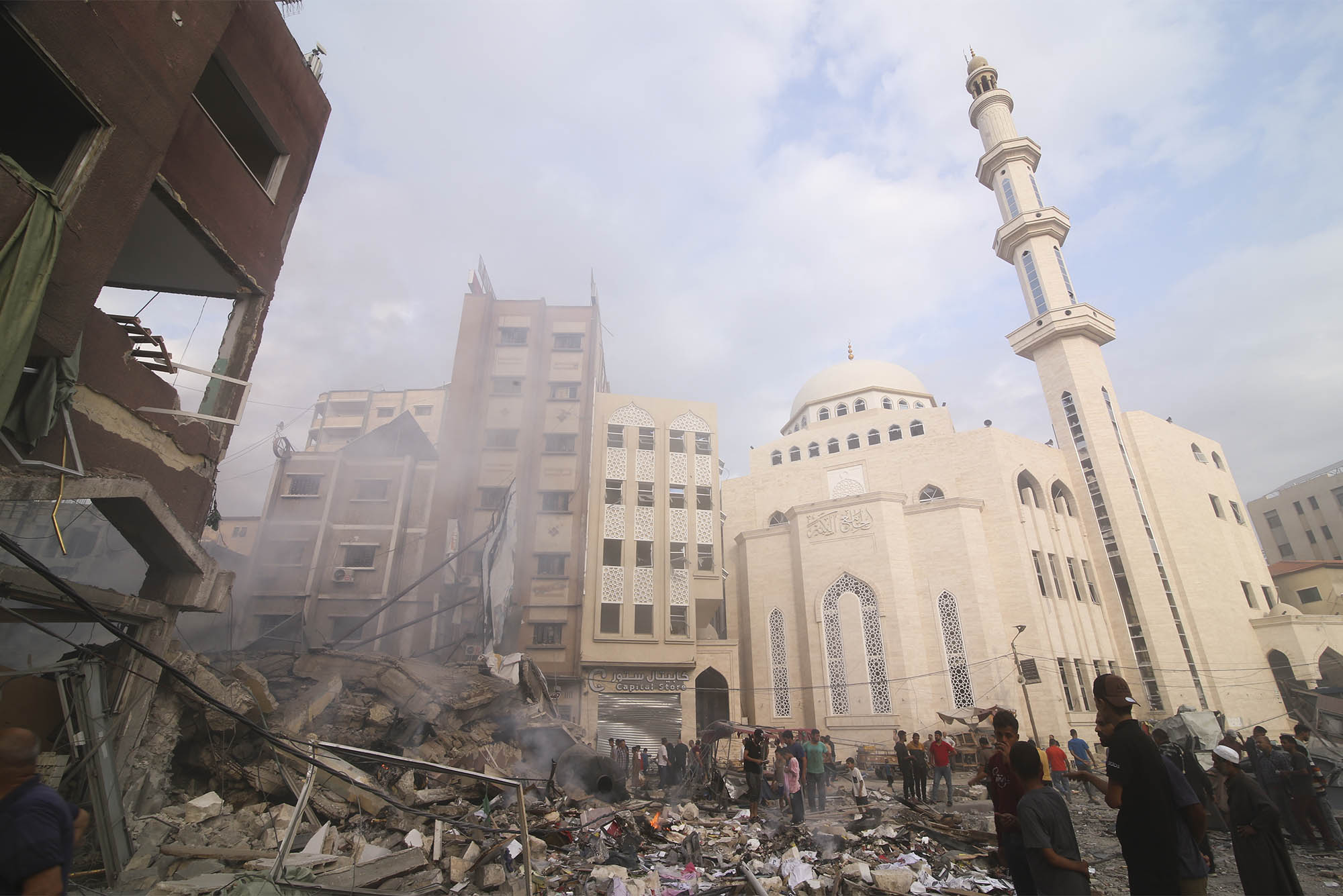 Photo: Palestinians inspect the damage of destroyed building after Israeli airstrikes in Khan Younis, Gaza Strip